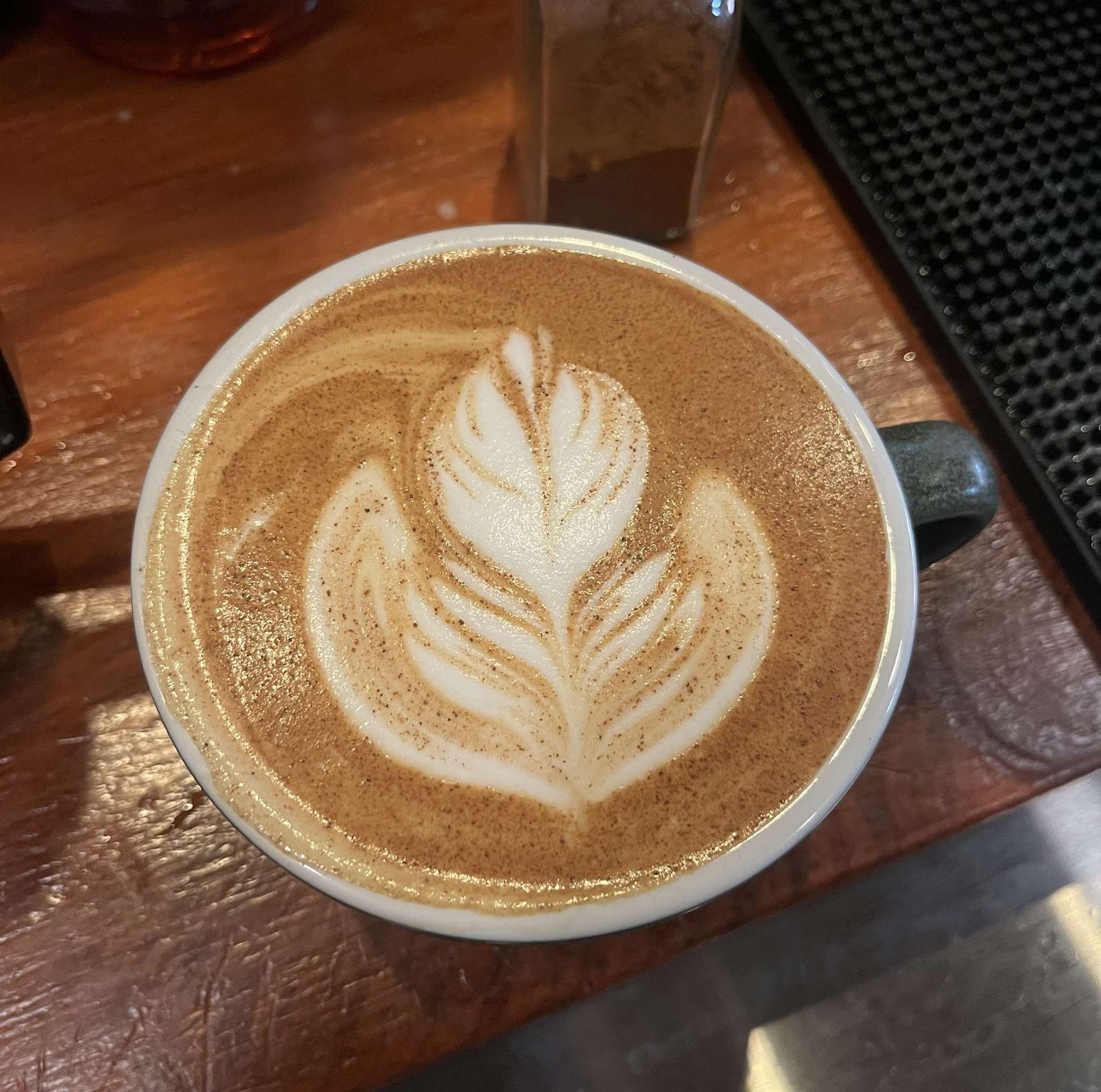 Freshly poured cappuccino with latte art at Good Day Café